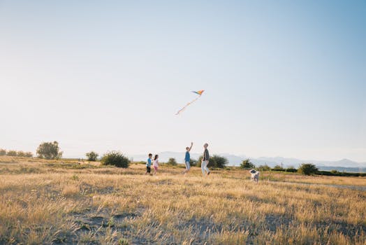 happy family playing with a dog